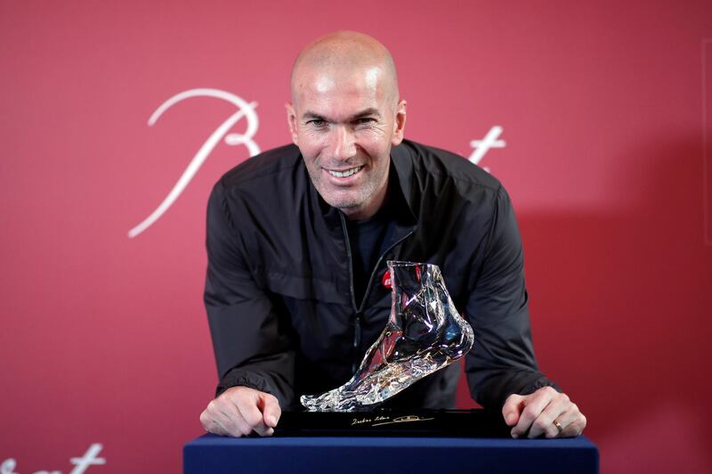 Former French soccer player and European Leukodystrophy Association (ELA) patron Zinedine Zidane poses with the "Zidane's Crystal Foot" created by Baccarat in Paris, France, June 12, 2018. REUTERS/Benoit Tessier