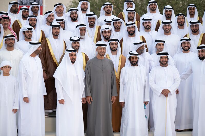 From right to left, Sheikh Ahmed bin Mohamed bin Rashed; Sheikh Saif bin Mohamed; Sheikh Tahnoun bin Mohamed, Ruler's Representative in Al Ain Region; Sheikh Mohamed bin Zayed, Crown Prince of Abu Dhabi and Deputy Supreme Commander of the Armed Forces; Sheikh Hamdan bin Zayed, Ruler’s Representative in Al Dhafra Region; Sheikh Saeed bin Zayed, Abu Dhabi Ruler's Representative; and Sheikh Hamdan bin Mansour bin Zayed stand for a photograph during a group wedding reception for Sheikh Zayed bin Mansour bin Zayed (2nd row, 4th R) and Sheikh Hazza bin Hamdan bin Zayed (2nd row, 5th R).