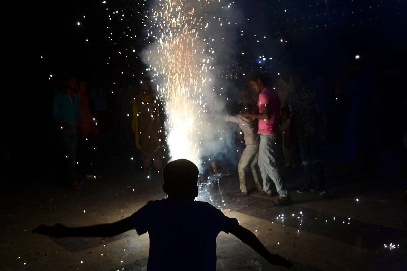 Pakistani Hindus light firecrackers in Karachi. AFP