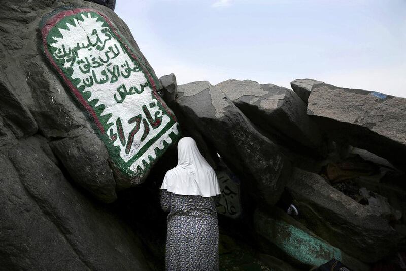 A Turkish woman prays inside Hiraa cave on Noor mountain  on the outskirts of Mecca in Saudi Arabia. Nariman El Mofty / AP Photo