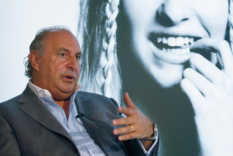 FILE - In this file photo dated Wednesday, June 5, 2013, Philip Green speaks during an interview at his new Topshop store in Hong Kong.  British politician Peter Hain has used British Parliament's free-speech guarantee to name the prominent businessman Philip Green, who according to Hain, is facing employee allegations of sexual harassment and racial abuse and previously secured a court order barring the media from revealing his identity. (AP Photo/Kin Cheung, FILE)