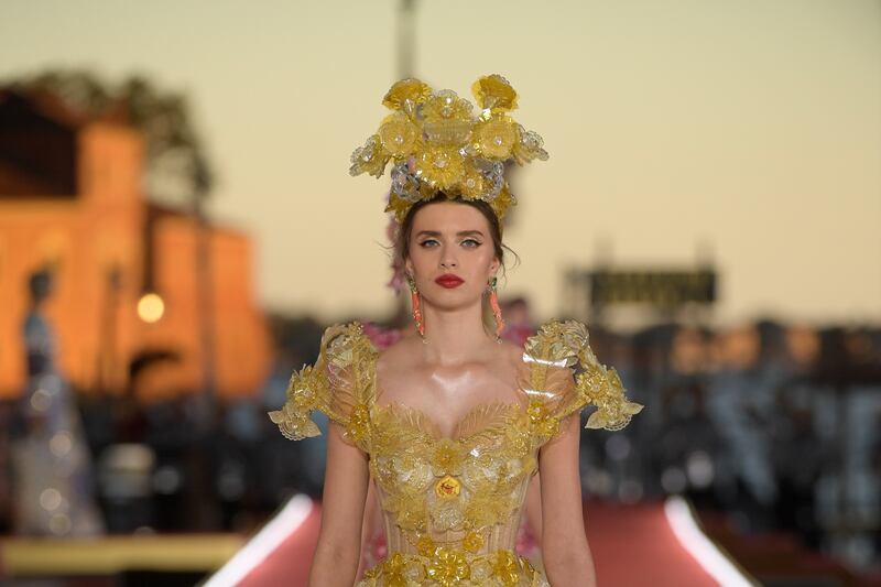 A model presents a look from Dolce & Gabbana's Alta Moda collection in Venice, Italy.