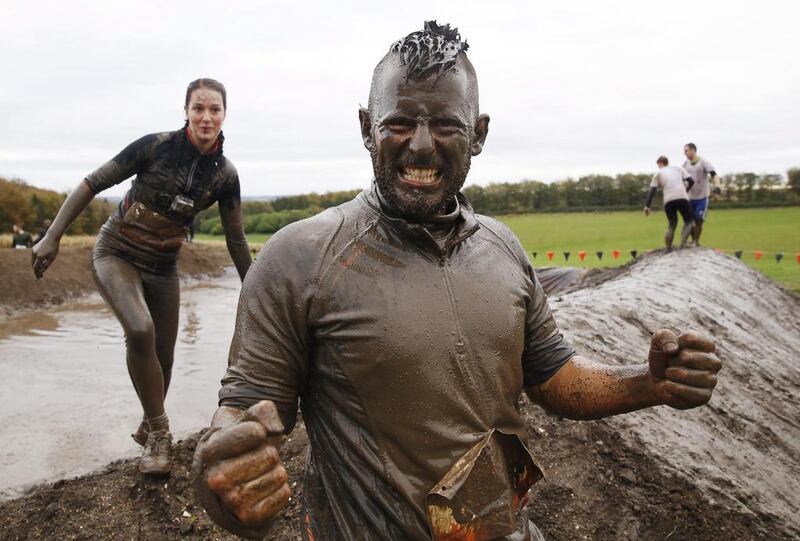Competitors participate in the Tough Mudder challenge near Winchester in southern England on Saturday. Luke MacGregor / Reuters