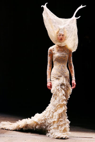 A handout phoo of Tulle and lace dress with veil and antlers by Alexander McQueen from Autumn/Winter 2006-07 show. (Courtesy: Penguin Random House) *** Local Caption ***  lm05mr-alexander-mcqueen05.JPG