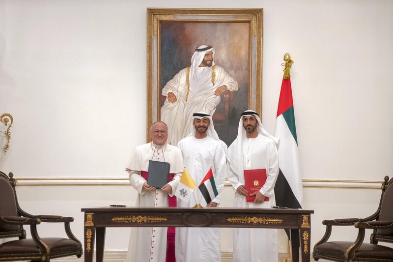 ABU DHABI, UNITED ARAB EMIRATES - November 18, 2019: (R-L) HE Mohamed Mubarak Al Mazrouei, Undersecretary of the Crown Prince Court of Abu Dhabi, HH Sheikh Mohamed bin Zayed Al Nahyan, Crown Prince of Abu Dhabi and Deputy Supreme Commander of the UAE Armed Forces and His Grace Archbishop Francisco Montecillo Padilla, personal envoy of His Holiness Pope Francis, stand for a photograph after signing of a collaborative declaration on global health, at the Sea Palace.

( Rashed Al Mansoori / Ministry of Presidential Affairs )
---