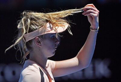 Ukraine's Elina Svitolina adjusts her hair while playing Katerina Siniakova of the Czech Republic during their second round match at the Australian Open tennis championships in Melbourne, Australia, Wednesday, Jan. 17, 2018. (AP Photo/Andy Brownbill)