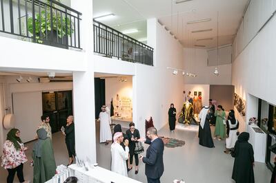 Visitors at the new group exhibition The Alumni Return. Tashkeel