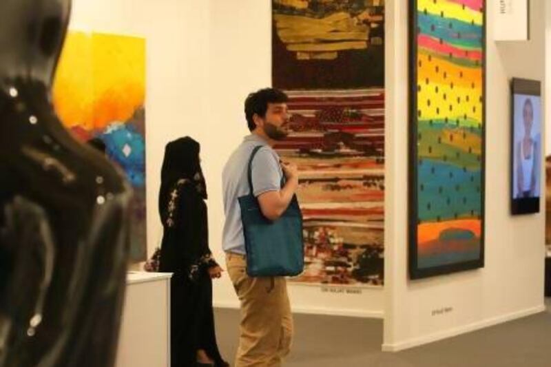 Omar Kholeif, above, at Art Dubai 2013, is the editor at Ibraaz online arts magazine and the founder of the UK's Arab Film Festival. Kholeif believes that "curating and critiquing are the same practice". Pawan Singh / The National