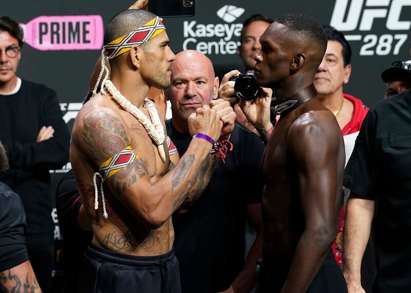 UFC middleweight champion Alex Pereira, left, faces challenger Israel Adesanya after the weigh-in for UFC 287. AP