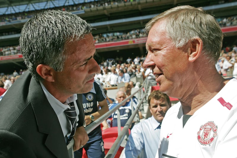 Chelsea's Portugese Manager Jose Mourinho (L) and Manchester United's Manager Sir Alex Ferguson (R) greet each other before their F.A Community Shield match football match at Wembley Stadium in London, 05 August 2007. AFP PHOTO/CARL DE SOUZA