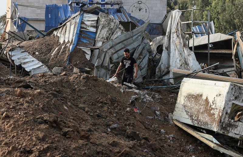 A man inspects the rubbles of a building destroyed by Israeli air strikes in Gaza. AFP