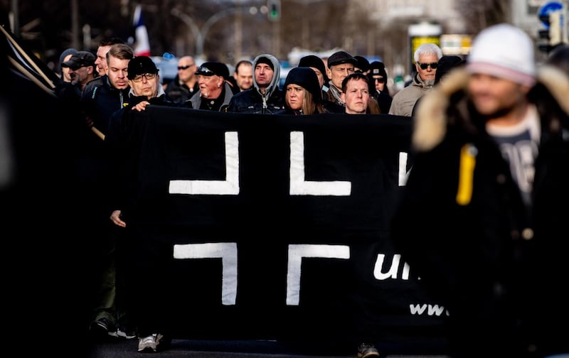 epa08220165 Neo-Nazi march during a protest in Dresden, Germany, 15 February 2020. The thousands of victims of the bombing of Dresden during World War II are commemorated annually on 13 February. Right-wing extremists held a rally to remember the victims of the bombing as several counter demonstrations took place.  EPA/FILIP SINGER