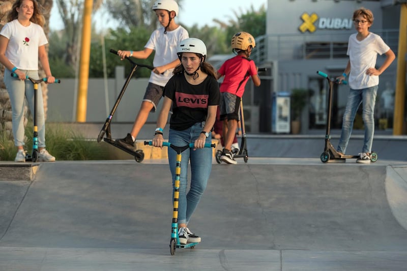 DUBAI, UNITED ARAB EMIRATES. 12 October 2017.  Skater girl article. A groth in girls taking up wheeled extreme sports has been noticed at the X Dubai Skate Park next to Kite Beach. Lea Salem (Canada 13) on her push scooter. (Photo: Antonie Robertson/The National) Journalist: Nick Webster. Section: National.