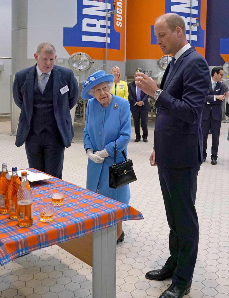 Queen Elizabeth and Prince William visit AG Barr's factory, where the Irn-Bru drink is manufactured, in Cumbernauld in 2021.