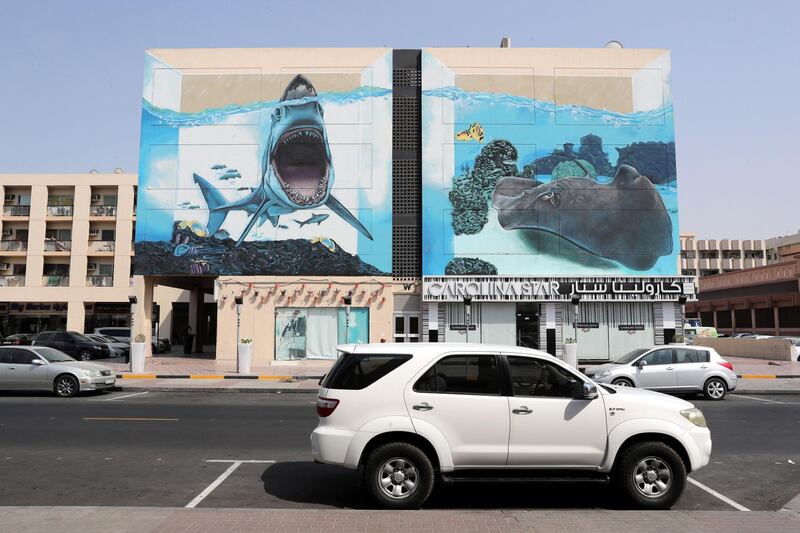 DUBAI , UNITED ARAB EMIRATES, September 20 , 2018 :- Artwork painted by different artists on the wall of Wasl Properties at the Karama shopping complex in Al Karama area in Dubai. ( Pawan Singh / The National )  For Big Picture/Online/Instagram