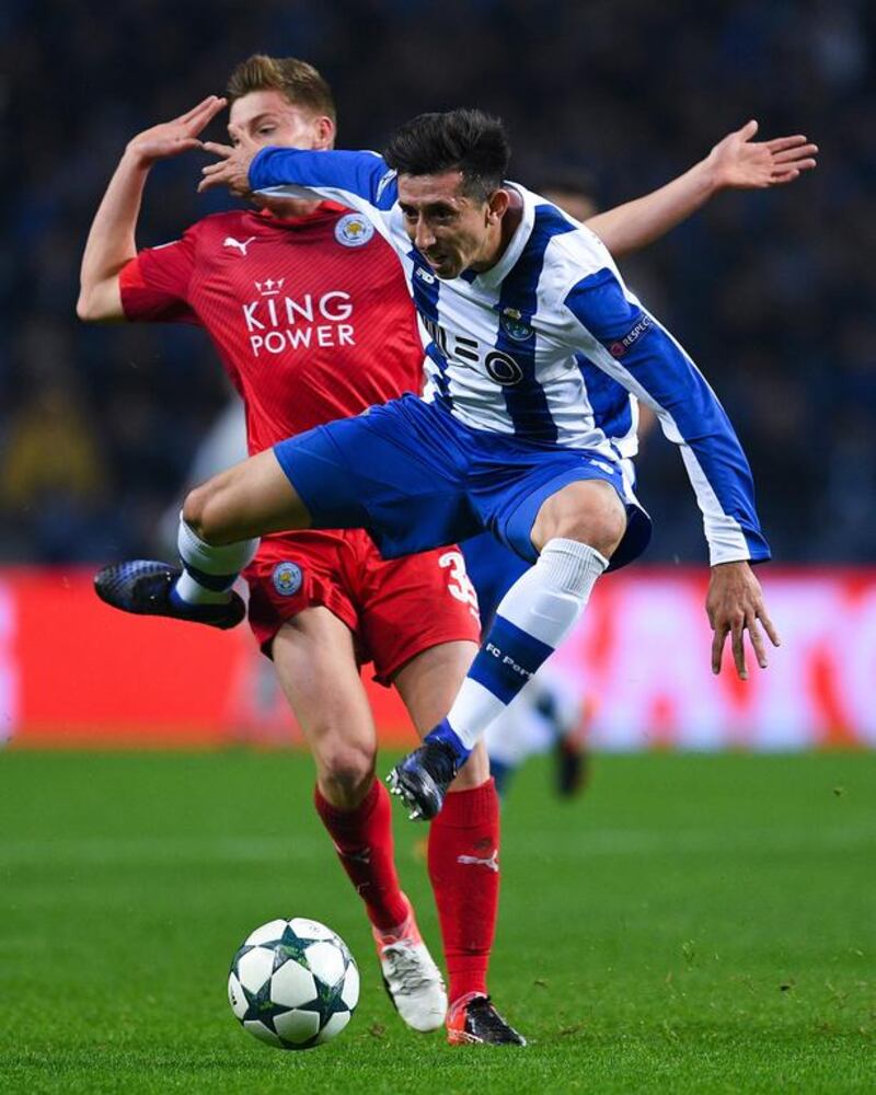 Hector Herrera of Porto competes for the ball with Harvey Barnes of Leicester City. David Ramos / Getty Images