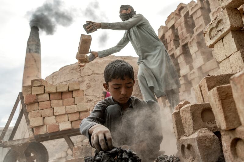 They pick through the smouldering charcoal from the kilns for pieces that can still be used, inhaling the soot and singeing their fingers.