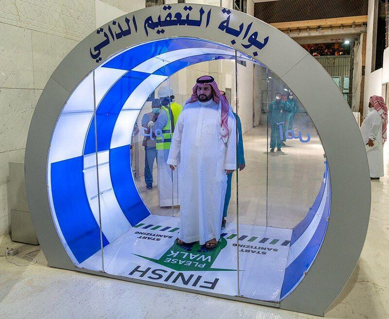 A Saudi man enters a new self-sterilisation gate at the Grand Mosque in Makkah, Saudi Arabia. Reuters