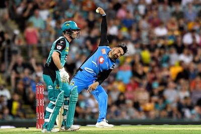 BRISBANE, AUSTRALIA - DECEMBER 19: Rashid Khan of the Strikers bowls during the Big Bash League match between the Brisbane Heat and the Adelaide Strikers at The Gabba on December 19, 2018 in Brisbane, Australia. (Photo by Albert Perez/Getty Images)