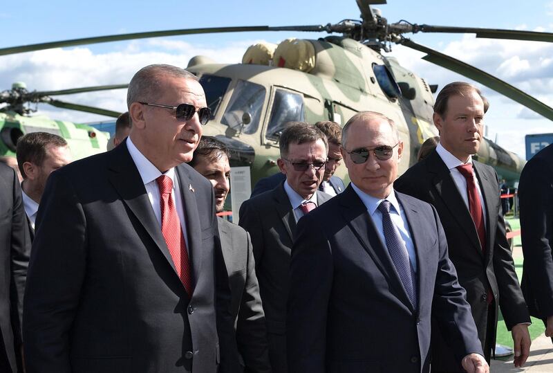 Russian President Vladimir Putin, second right, and Turkish President Recep Tayyip Erdogan attend the MAKS-2019 International Aviation and Space Show in Zhukovsky, outside Moscow, Russia, Tuesday, Aug. 27, 2019. Turkish President is on a short working visit in Russia. (Alexei Nikolsky, Sputnik, Kremlin Pool Photo via AP)