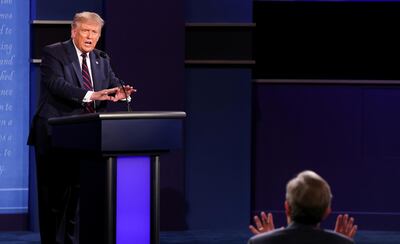 President Donald Trump argues with debate moderator Chris Wallace of Fox News Channel during the first 2020 presidential campaign debate with Democratic presidential nominee Joe Biden held on the campus of the Cleveland Clinic at Case Western Reserve University in Cleveland, Ohio, U.S., September 29, 2020. REUTERS/Jonathan Ernst     TPX IMAGES OF THE DAY