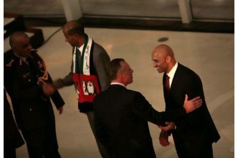 Yousef Al Otaiba, right, the UAE Ambassador to the US, greets guests during the National Day event at the United States Institute for Peace in Washington, DC. Andrew Council for The National