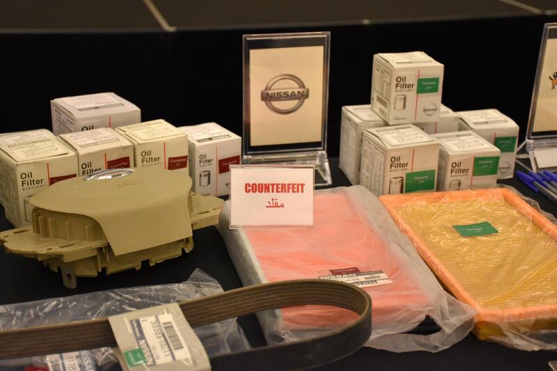 Counterfeit and genuine goods are displayed side by side during a seminar run by the Legal Group. Photo Courtesy The Legal Group