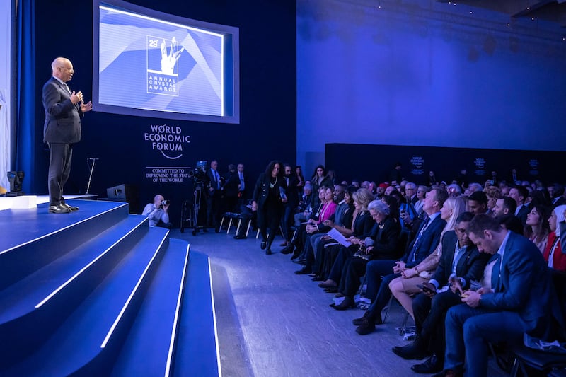 Mr Schwab delivers a speech during the 'Crystal Award' ceremony in Davos. AFP