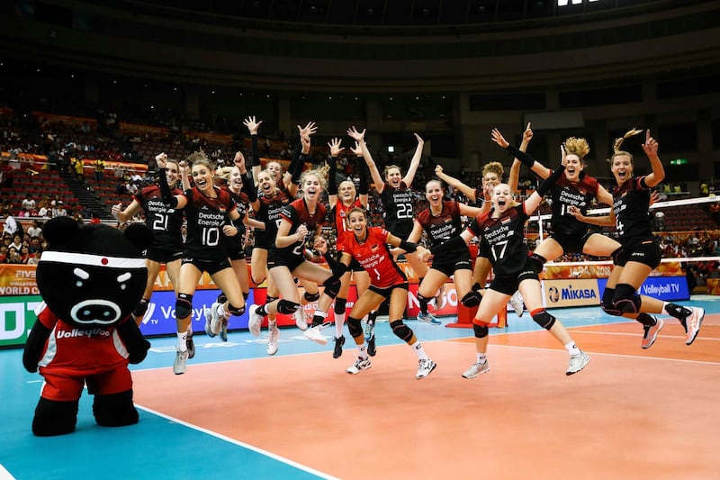 Germany's players jump up for a picture during their second round match against Brazil at the FIVB Volleyball Women's World Championship in Nagoya, northern Japan. AP Photo