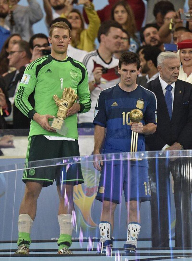 Germany's goalkeeper Manuel Neuer, left, winner of the golden glove award for best goalkeeper stands alongside golden ball winner Argentina's Lionel Messi after the World Cup final soccer match between Germany and Argentina at the Maracana Stadium in Rio de Janeiro, Brazil on Sunday, July 13, 2014. Germany won the match 1-0. AP Photo/Martin Meissner
