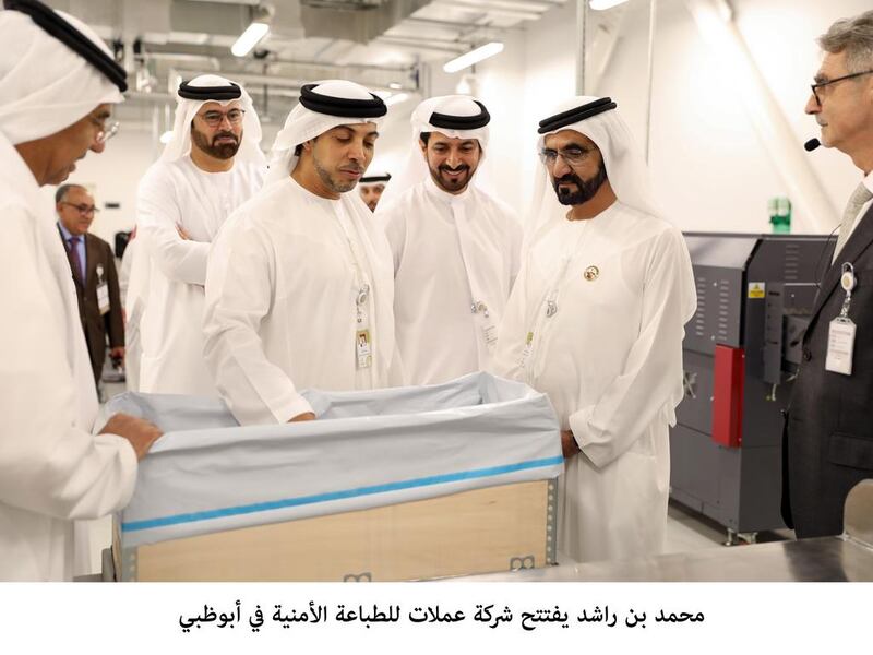 Sheikh Mohammed bin Rashid, Vice President and Ruler of Dubai, is accompanied by Sheikh Mansour bin Zayed, Deputy Prime Minister and Minister of Presidential Affairs, Mohammad Al Gergawi, Minister of Cabinet Affairs and the Future, and Obaid Humaid Al Tayer, Minister of State for Financial Affairs, during a tour of Oumolat Security Printing. Wam