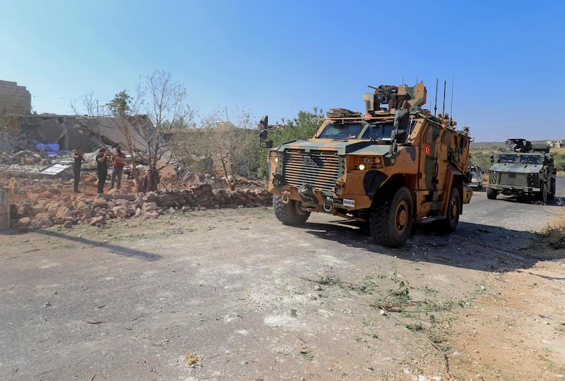 Turkish troops in armoured personnel carriers in the village of Iblin in the Jabal Al Zawiya region of Syria's rebel-held north-western Idlib province, on July 22, 2021. AFP
