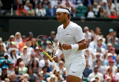 Spain's Rafael Nadal celebrates after winning a point against Portugal's Joao Sousa in a Men's singles match during day seven of the Wimbledon Tennis Championships in London, Monday, July 8, 2019. (AP Photo/Alastair Grant)