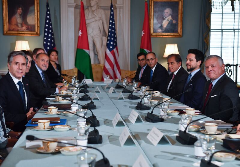 At the State Department in Washington, US Secretary of State Antony Blinken, left, meets Jordan's King Abdullah II, right, as Jordan's Crown Prince Hussein, second right, looks on.