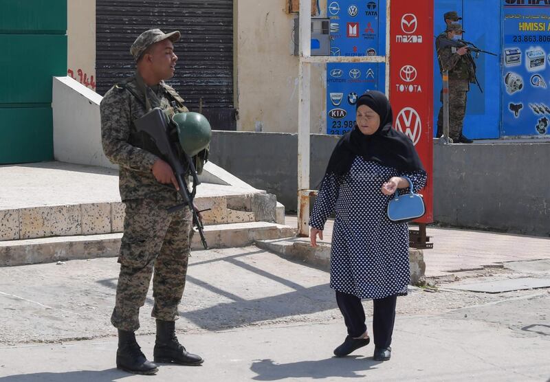 Tunisian soldiers stand guard in front of the headquarters of Mnihla delegation in Ariana Governorate. AFP