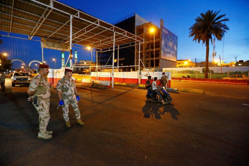 Iraqi soldiers guard a street, enforcing a curfew imposed to prevent the spread of the coronavirus, during the month of Ramadan, in Baghdad, Iraq. Reuters