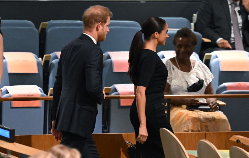 Prince Harry and his wife Meghan leave the UN Nelson Mandela Prize award ceremony. AFP