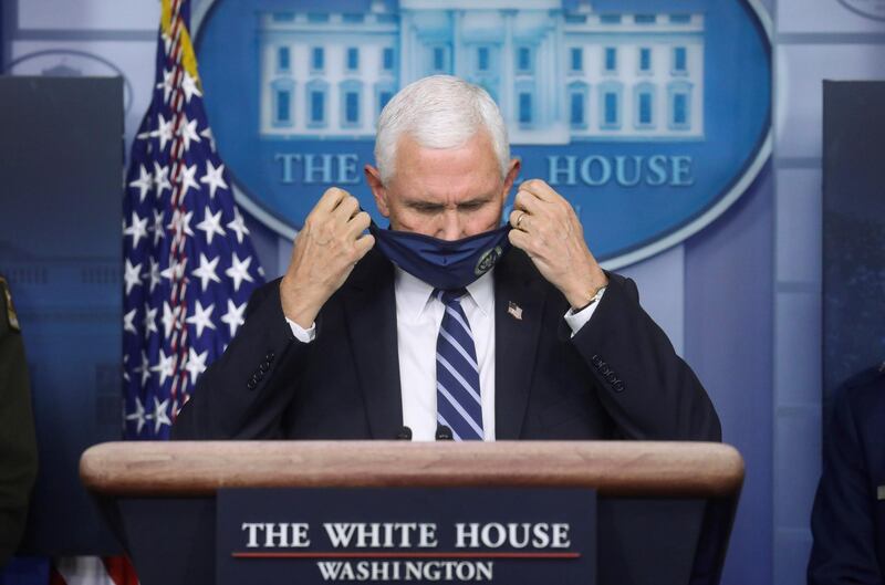 U.S. Vice President Mike Pence takes off his protective face mask to speak as he leads a briefing by the White House coronavirus task force about the U.S. spread of coronavirus disease (COVID-19) in the Brady press briefing room at the White House in Washington, U.S. REUTERS