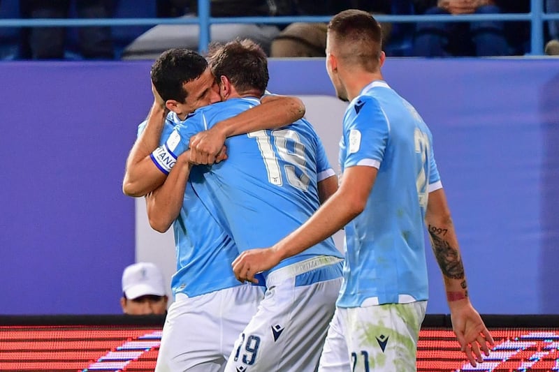 Lazio's Senad Lulic celebrates scoring their second goal with teammates. Lazio won the match 3-1. Reuters