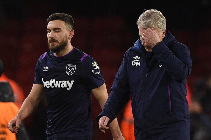 West Ham United manager David Moyes (R) reacts at the end of the match. AFP