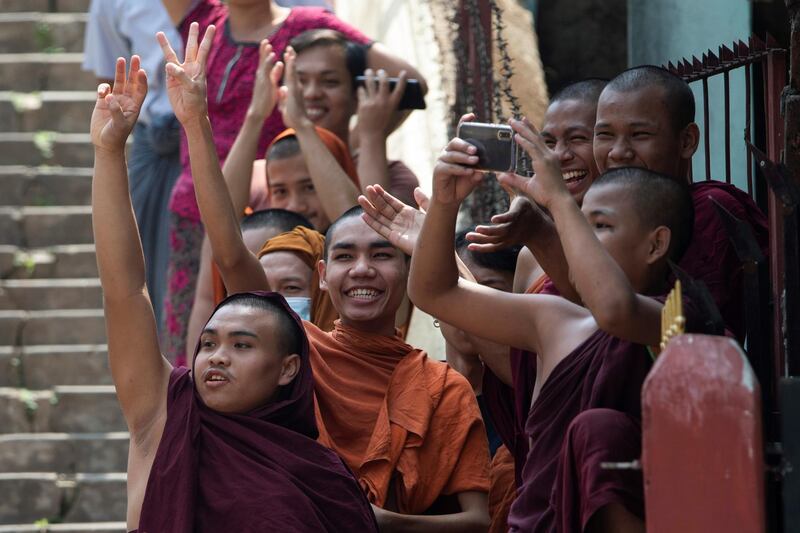 Buddhist monks show the three-finger salute as they take part in a protest against the military coup and to demand the release of elected leader Aung San Suu Kyi, in Yangon, Myanmar. Reuters