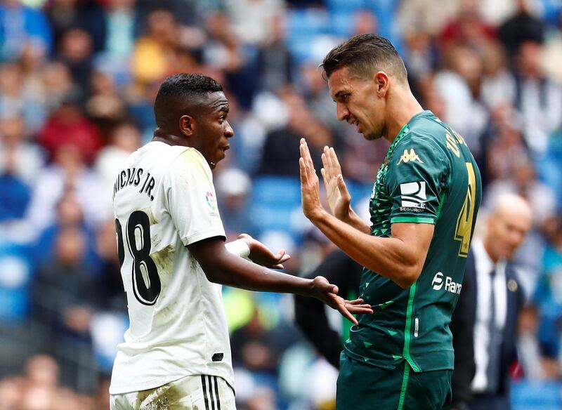 Real Madrid's Vinicius Junior and Real Betis' Zouhair Feddal remonstrate with each other. Reuters