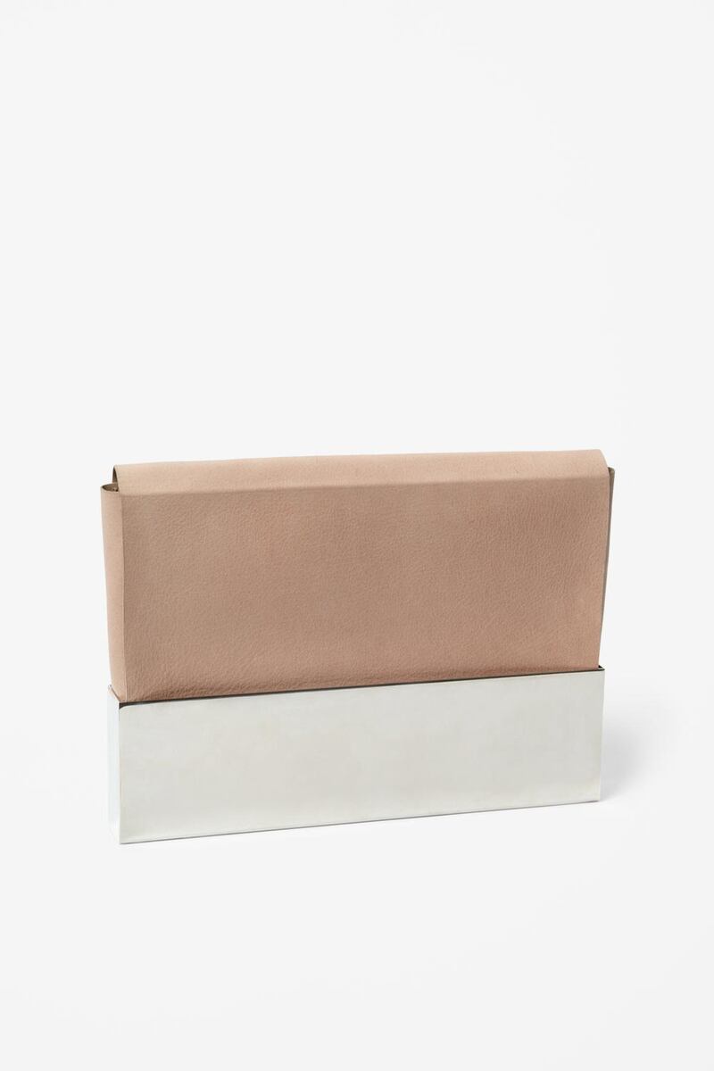 A handout photo of Leather and Metal clutch (Courtesy: Cos)