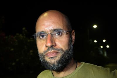 A 2011 photo of Saif Al Islam, the son of late Libyan dictator, in front of supporters and journalists at his father's residential complex in the Libyan capital of Tripoli. AFP 