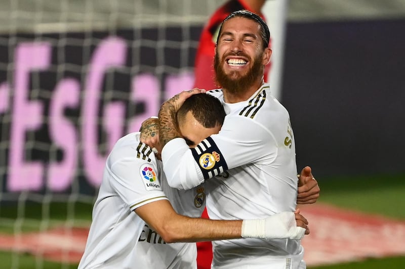 Real Madrid's Karim Benzema celebrates with Sergio Ramos. AFP