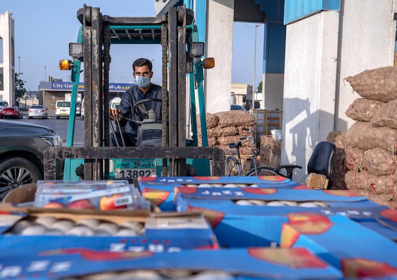 April 26, 2021. A forklift driver at the Abdulla Hassan Trading Establishment, one of the original fruits and vegetable shops in Abu Dhabi which was opened in 1970. Victor Besa / The National.
Section: News/Standalone