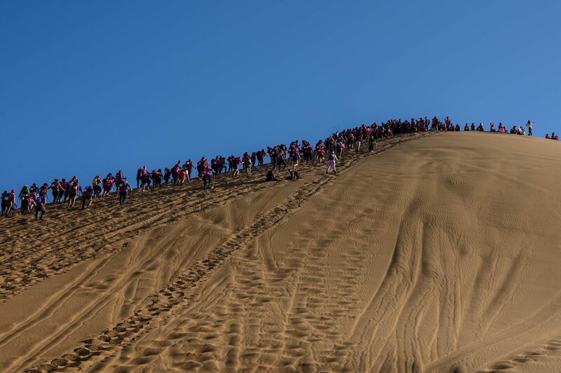 Participants hike with minimum environmental impact. AFP