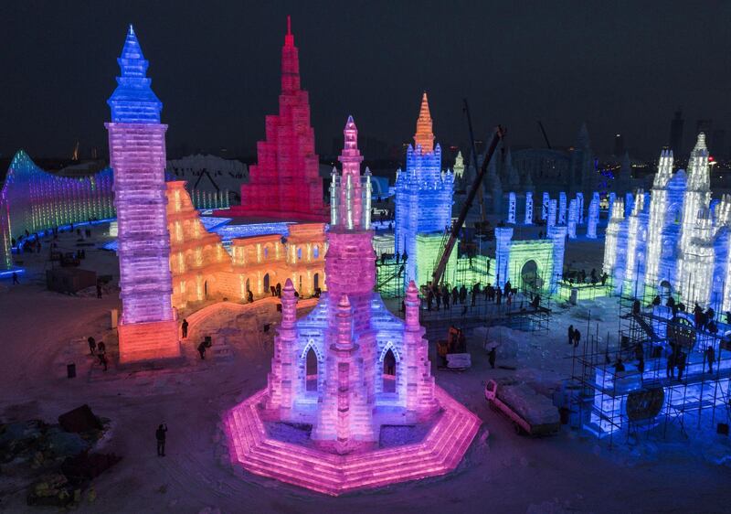 Chinese labourers work on large ice sculptures in preparation for the Harbin Ice and Snow Festival. Getty Images
