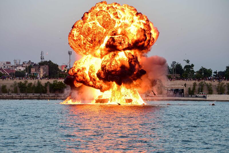 A dummy target is exploded by mines laid by the Indian Navy, as a part of rehearsals for the upcoming defence equipment exhibition at the Sabarmati Riverfront in Ahmedabad. AFP