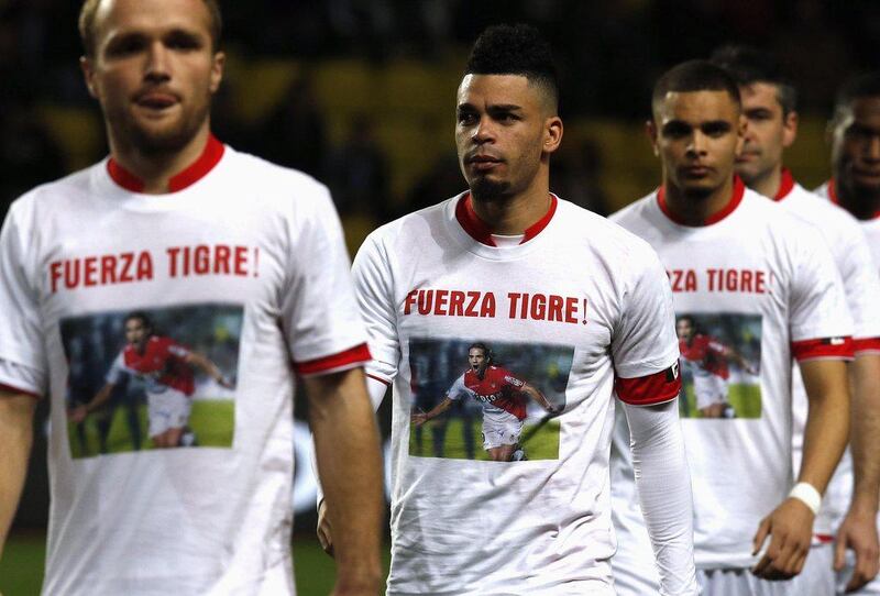 Valere Germain, left, Emmanuel Riviere, centre and the rest of Monaco came out in 'Fuerze Tigre' ('Strength Tiger') shirts for injured Radamel Falcao on Sunday. Germain and Riviere both scored in the win. Eric Gaillard / Reuters